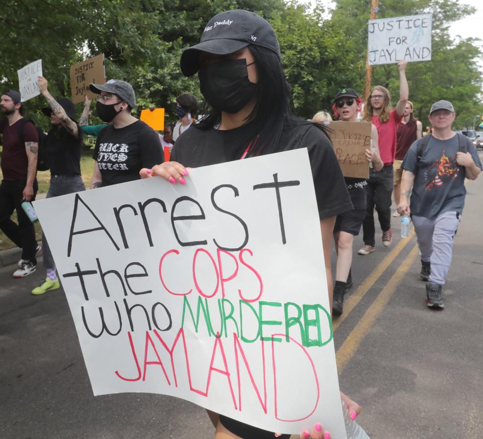 Protesters march Monday on Howard Street in Akron over the police shooting of Jayland Walker.