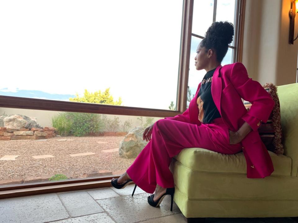 Regina King in a double-breasted fuchsia wool Schiaparelli suit