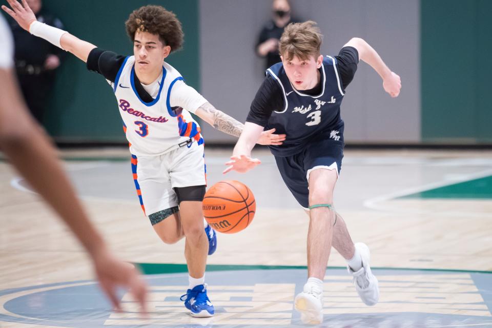 York High's Jacere Vega guards West York Braedyn Detz during a YAIAA boys' semifinal game at York Tech, Tuesday, Feb. 14, 2023, in York Township. The Bearcats won, 47-43. 