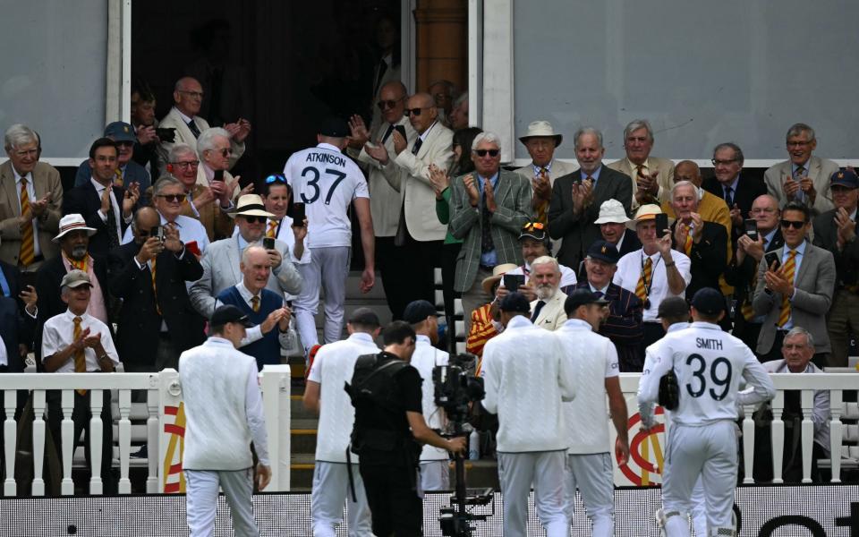 Gus Atkinson leads England off the field