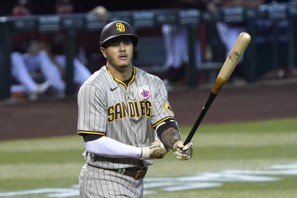 San Diego Padres' Manny Machado reacts after drawing a walk against the Arizona Diamondbacks in the first inning during a baseball game, Sunday, Aug 16, 2020, in Phoenix. (AP Photo/Rick Scuteri)