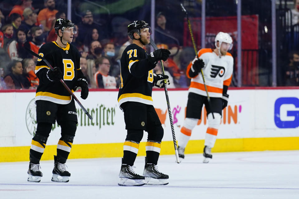 Boston Bruins' Taylor Hall, center, reacts after scoring a goal during the second period of an NHL hockey game against the Philadelphia Flyers, Wednesday, Oct. 20, 2021, in Philadelphia. (AP Photo/Matt Slocum)