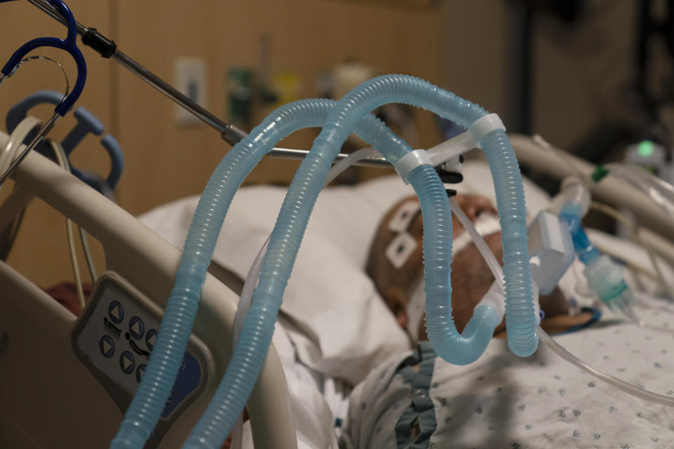 FILE - In this Nov. 19, 2020, file photo, ventilator tubes are attached to a COVID-19 patient at Providence Holy Cross Medical Center in the Mission Hills section of Los Angeles. U.S. deaths from COVID-19 are falling again as the nation recovers from the devastating winter surge. (AP Photo/Jae C. Hong, File)