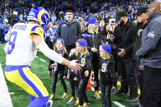 <p>Steven King/Icon Sportswire via Getty</p> Matthew Stafford opens his arms for a hug from his four daughters