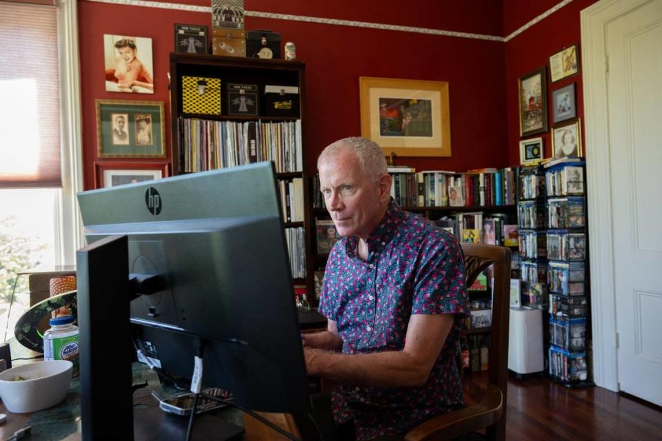 James Fitzpatrick, who’s lived near R Street since 1989, works from his home office July 19. He says he’s seen the neighborhood develop into a vibrant district. Paul Kitagaki Jr./pkitagaki@sacbee.com