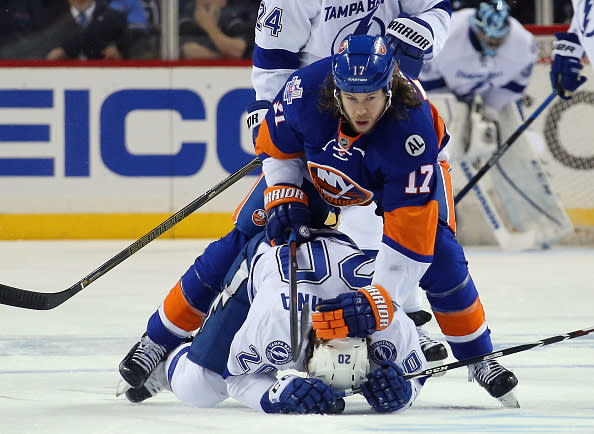 NEW YORK, NY - MAY 03: Matt Taormina #20 of the Tampa Bay Lightning is checked by Matt Martin #17 of the New York Islanders during the first period in Game Three of the Eastern Conference Second Round during the 2016 NHL Stanley Cup Playoffs at the Barclays Center on May 03, 2016 in the Brooklyn borough of New York City. (Photo by Bruce Bennett/Getty Images)