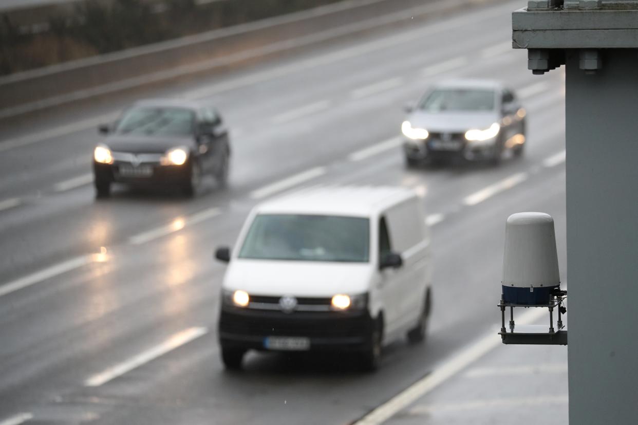 <p>Vehicles pass a Stopped Vehicle Detection radar sensor mounted adjacent to the southbound carriageway near Bagshot in Surrey where the M3 has been converted into a smart motorway</p> (PA)