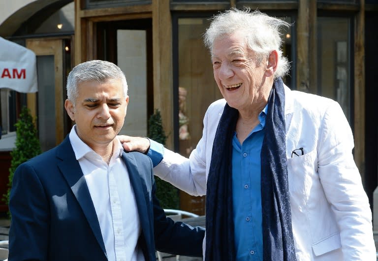 Sadiq Khan (L), is greeted by actor Ian McKellen as he arrives for his swearing-in ceremony at Southwark Cathedral on May 7, 2016