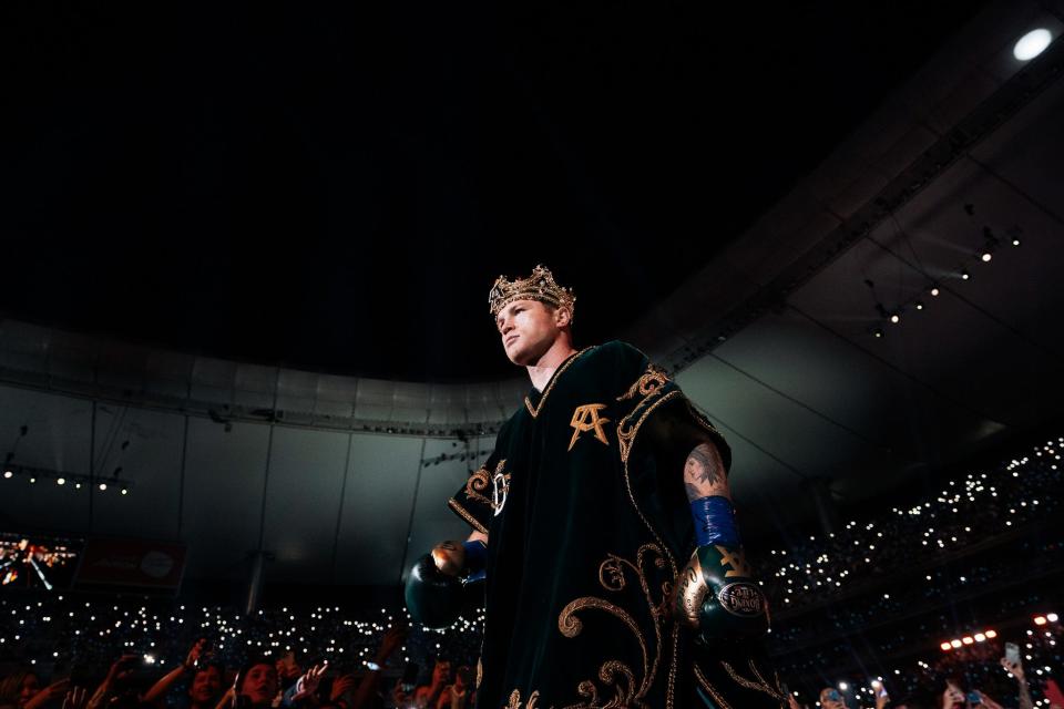 Saúl "Canelo" Álvarez walks into the ring for his fight against John Ryder. The super middleweight champion takes on Jermell Charlo to defend his title.