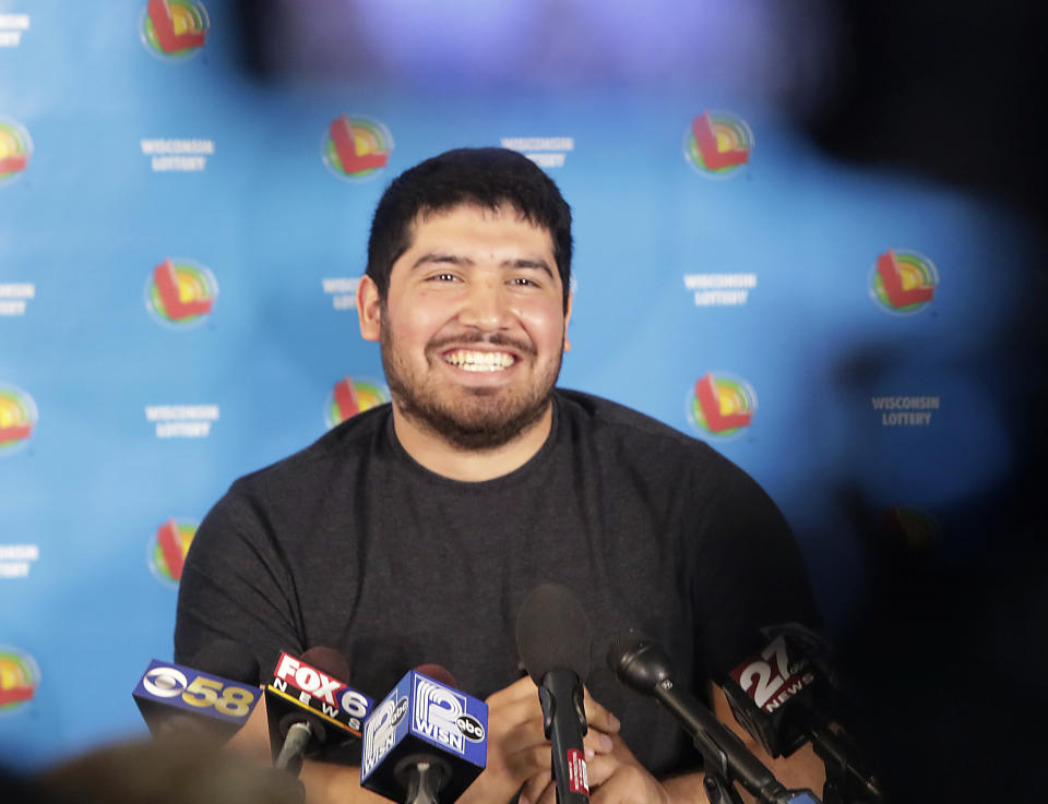 Manuel Franco of West Allis, Wis., winner of second-highest Powerball lottery in history, appears during a press conference at the Wisconsin Department of Revenue, in Madison, Wis. Tuesday, April 23, 2019. Franco claimed the cash option payout of the prize, totaling approximately $477 million before taxes. The overall jackpot of the prize, drawn March 22, was $768,400. (John Hart/Wisconsin State Journal via AP)