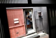 Yoko Ichihara cooks whale meat dishes inside the kitchen at her restaurant named P-man in Minamiboso