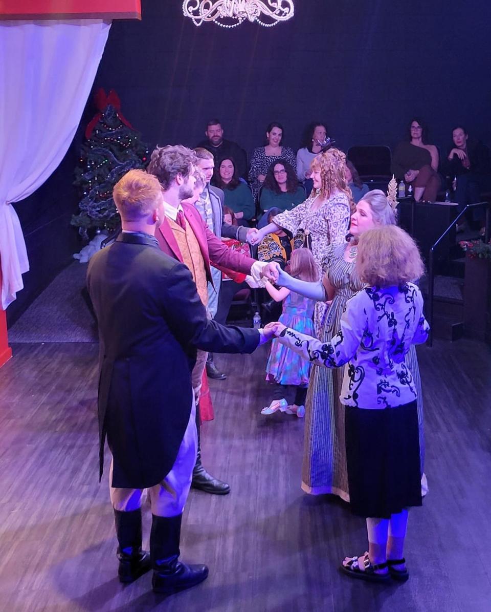 The cast of Oklahoma Shakespeare in the Park's new production of "Jane Austen's Christmas Cracker" prepares to perform the Regency Era dance Dover Pier with members of the audience during opening night Dec. 9, 2022.