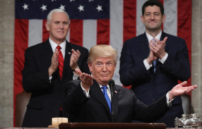 President Donald Trump delivers his first State of the Union address to Congress in 2018 as Vice President Mike Pence and House Speaker Paul Ryan applaud.