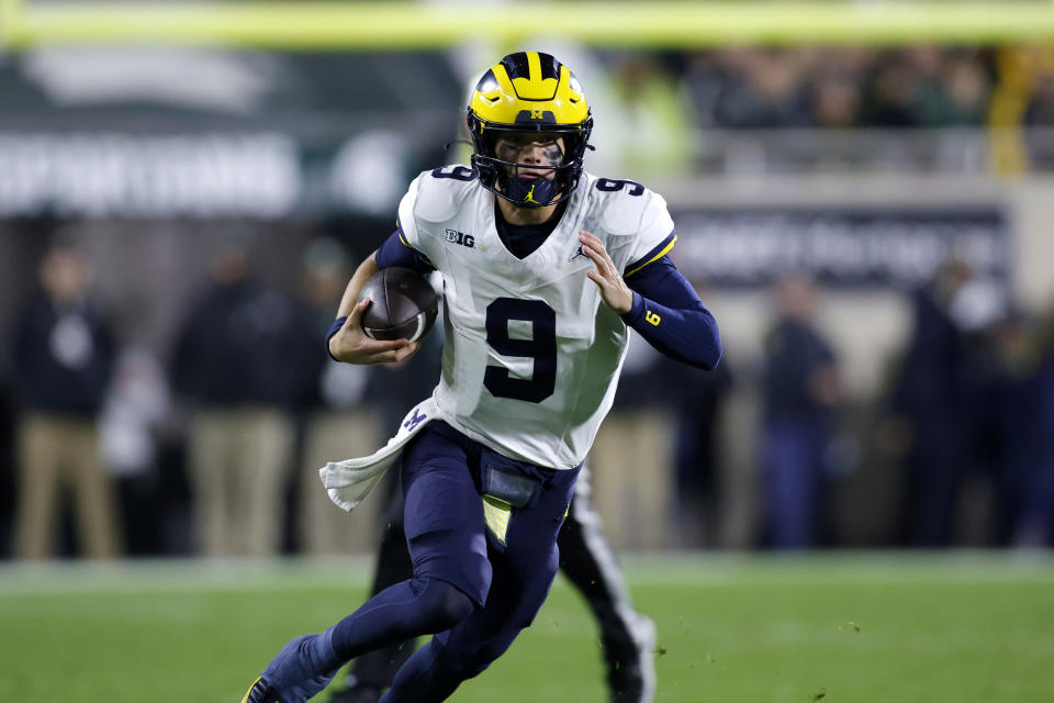 Michigan quarterback J.J. McCarthy runs on a keeper during the first half of an NCAA college football game against Michigan State, Saturday, Oct. 21, 2023, in East Lansing, Mich. (AP Photo/Al Goldis)