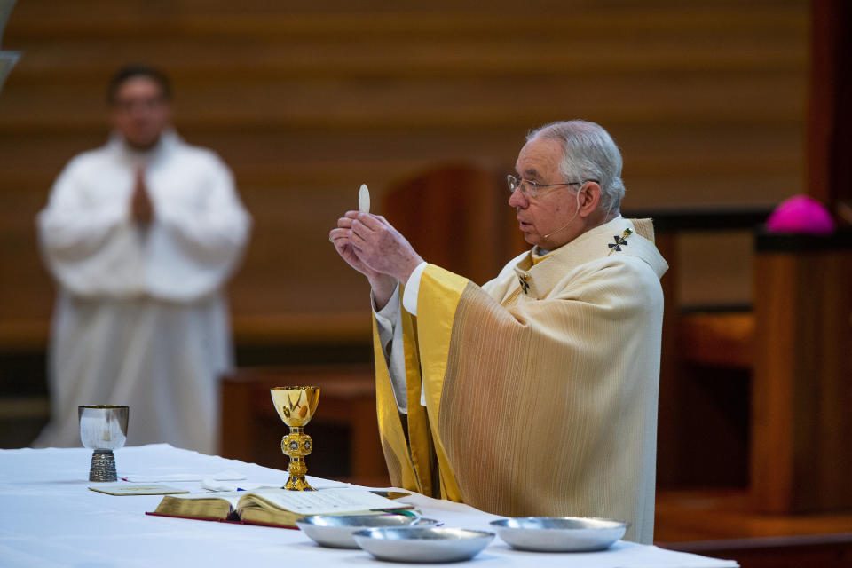 FILE - In this Sunday, June 7, 2020 file photo, Archbishop Jose H. Gomez celebrates the the Solemnity of the Most Holy Trinity Mass at the Cathedral of Our Lady of the Angels in downtown Los Angeles. Gomez is serving as the United States Conference of Catholic Bishops president since 2019. (AP Photo/Damian Dovarganes)