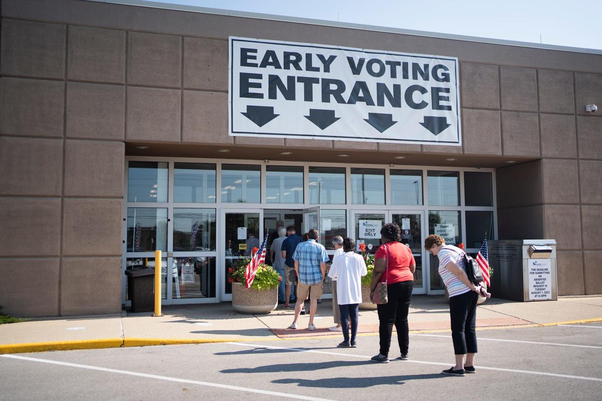 A steady stream of voters comes and goes on the first day of early voting for Issue 1 Tuesday at the Franklin County Board of Elections.