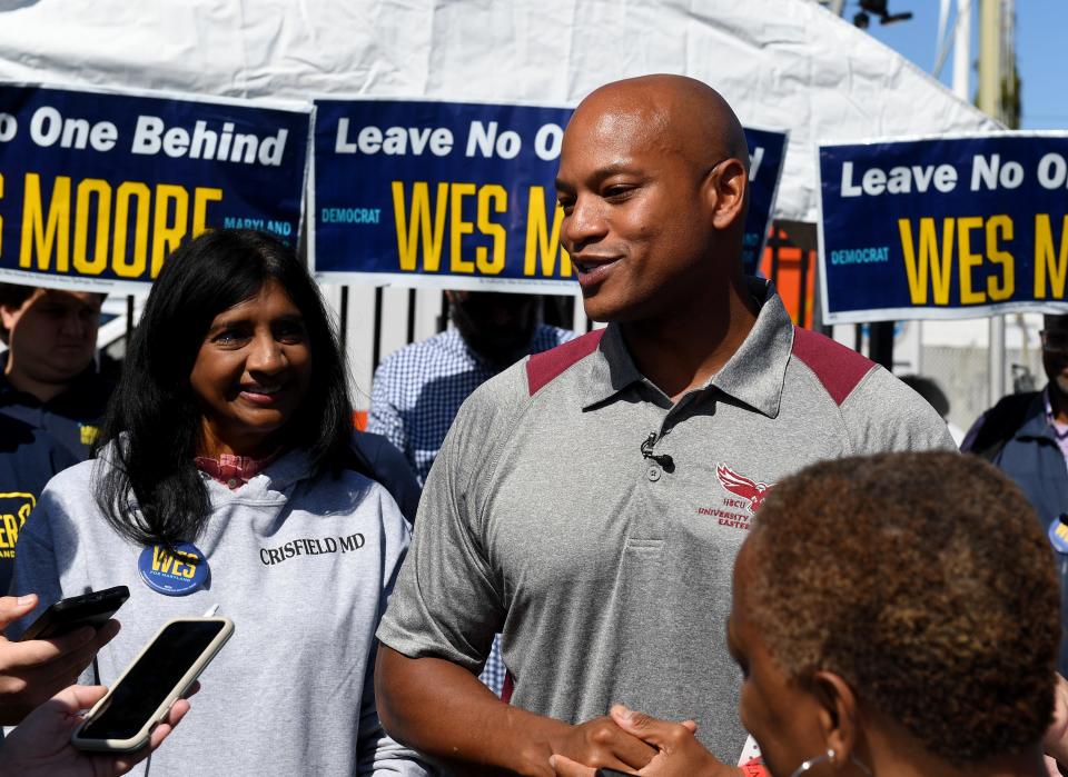 In this file photo, Wes Moore stands next to Aruna Miller (now Lt. Governor) at the 45th Annual J. Millard Tawes Crab and Clam Bake Wednesday, Sept. 28, 2022, at Somers Cove Marina in Crisfield, Maryland. This month, in a letter to U.S. Commerce Secretary Gina Raimondo, Moore asked for federal support to address invasive species in the Chesapeake Bay.
