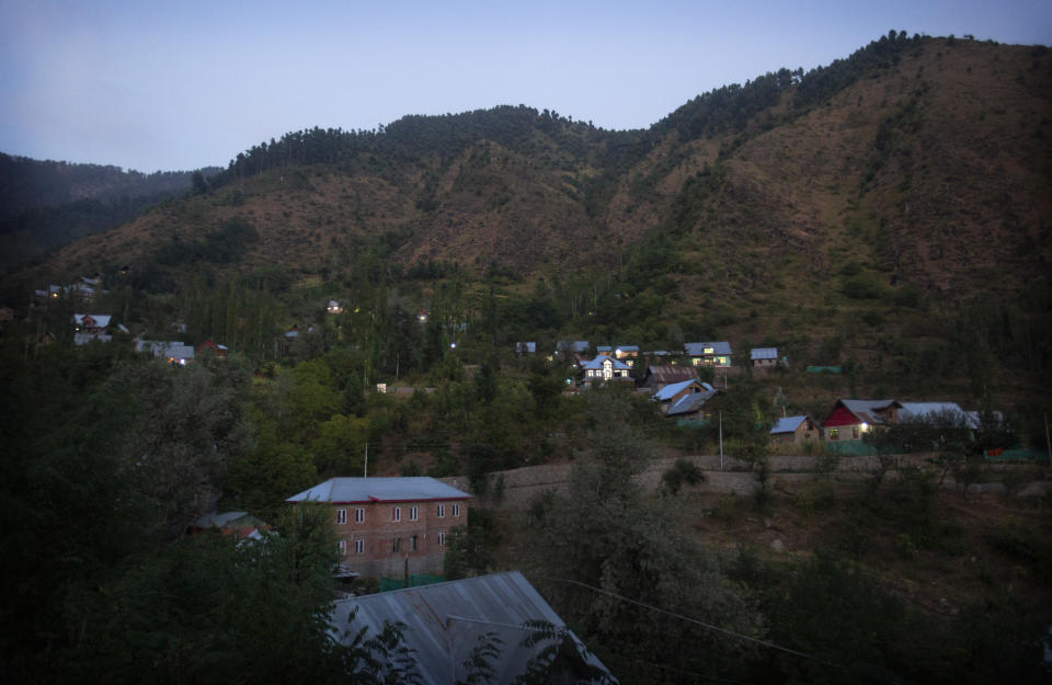 The Dardkhor village, where several cases of wild animals attacking villagers have been reported is seen at dusk on the outskirts of Srinagar, Indian controlled Kashmir, Monday, Aug. 24, 2020. Amid the long-raging deadly strife in Indian-controlled Kashmir, another conflict is silently taking its toll on the Himalayan region’s residents: the conflict between man and wild animals. According to official data, at least 67 people have been killed and 940 others injured in the past five years in attacks by wild animals in the famed Kashmir Valley, a vast collection of alpine forests, connected wetlands and waterways known as much for its idyllic vistas as for its decades-long armed conflict between Indian troops and rebels. (AP Photo/Mukhtar Khan)