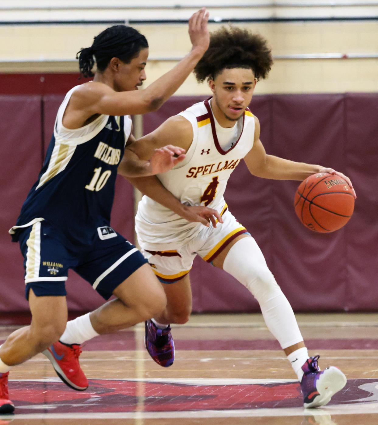 Cardinal Spellman's D'Anthony Amado dribbles around Archbishop Williams defender Yves Conde during a game on Friday, Jan. 26, 2024.