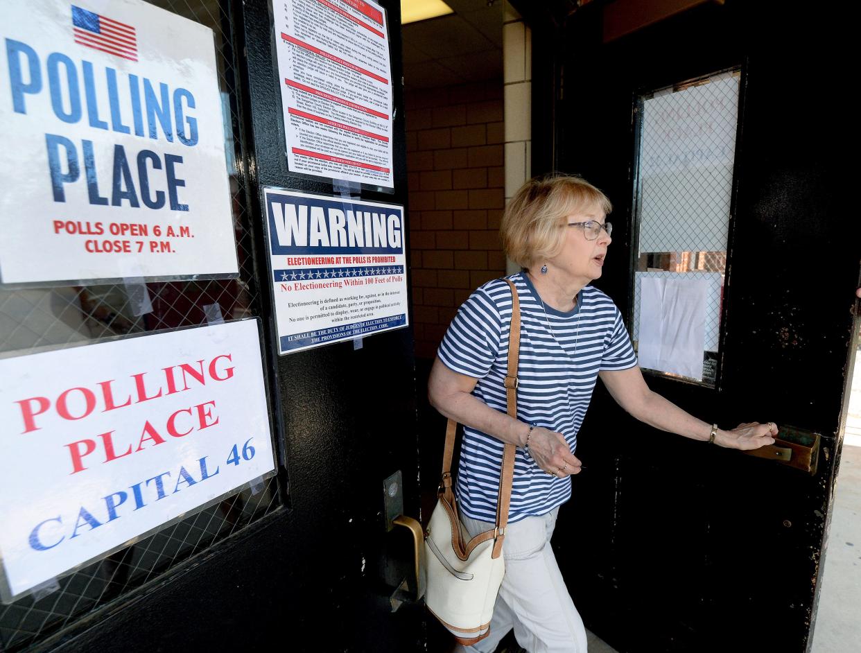 Susan Meister exits Springfield High School after voting in the primary on June 28, 2022.