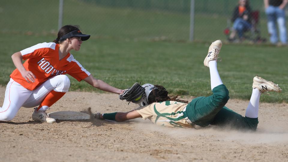 Hoover’s Anna Jones tags out GlenOak’s Makayla Mariccini at second in the first inning at GlenOak Tuesday, March 30, 2021.