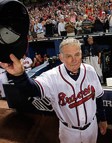 Bobby Cox waves to the home crowd and the Giants, who saluted the 69-year-old after his final game as Braves manager