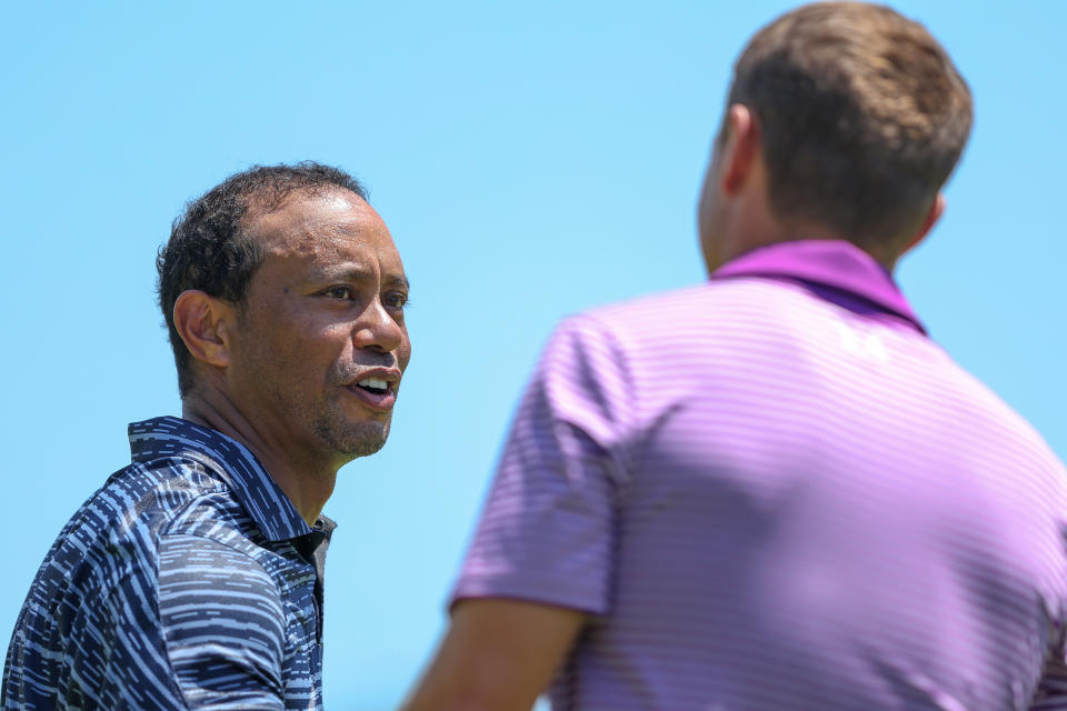 Tiger Woods, pictured here shaking hands with Jordan Spieth after the opening round of the PGA Championship.