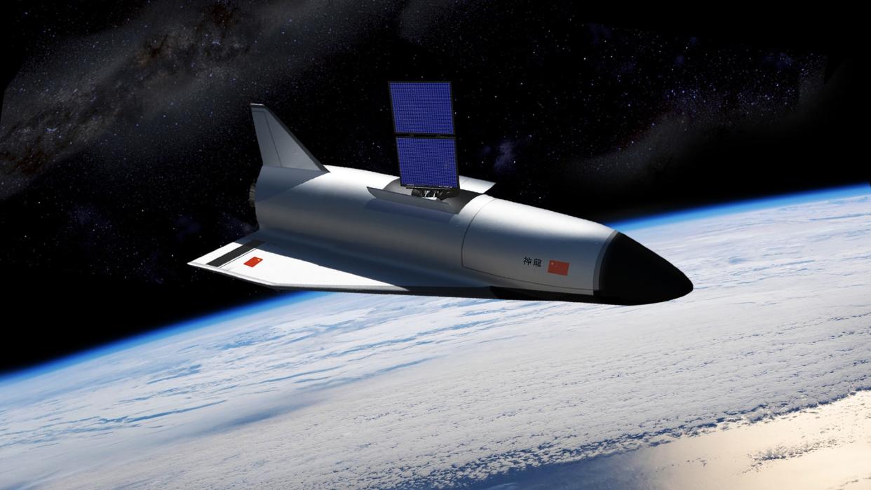  a space plane in orbit above Earth 