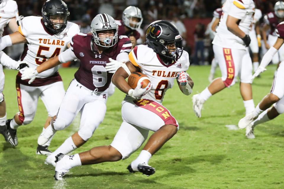 Tulare Union's Tieler Peterson rushes against Mt. Whitney in a non-league high school football game at Mineral King Bowl on August 18th, 2023.