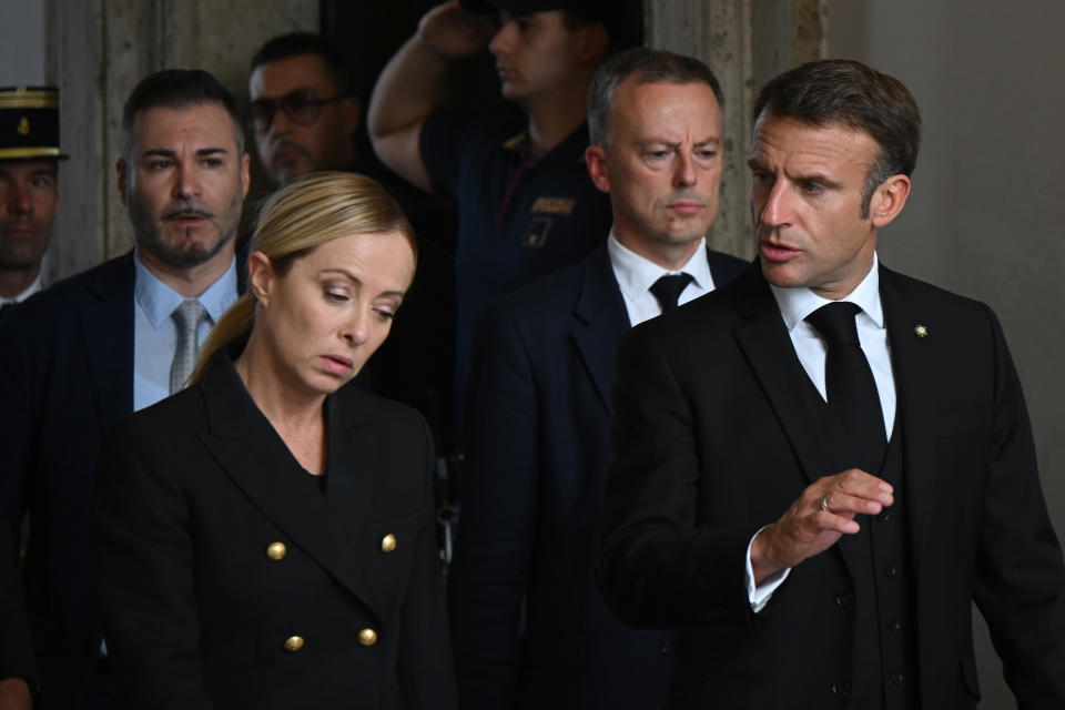 FILE - France's President Emmanuel Macron, right, arrives with Italy's Premier Giorgia Meloni prior to a meeting at Palazzo Chigi government's office in Rome, Tuesday, Sept. 26, 2023. When Giorgia Meloni took office a year ago as the first far-right premier in Italy's post-war history, concern was palpable abroad about the prospect of democratic backsliding and resistance to European Union rules. But since being sworn in as premier on Oct. 22, 2022, Meloni has confounded Western skeptics. (Filippo Monteforte Pool via AP, File)