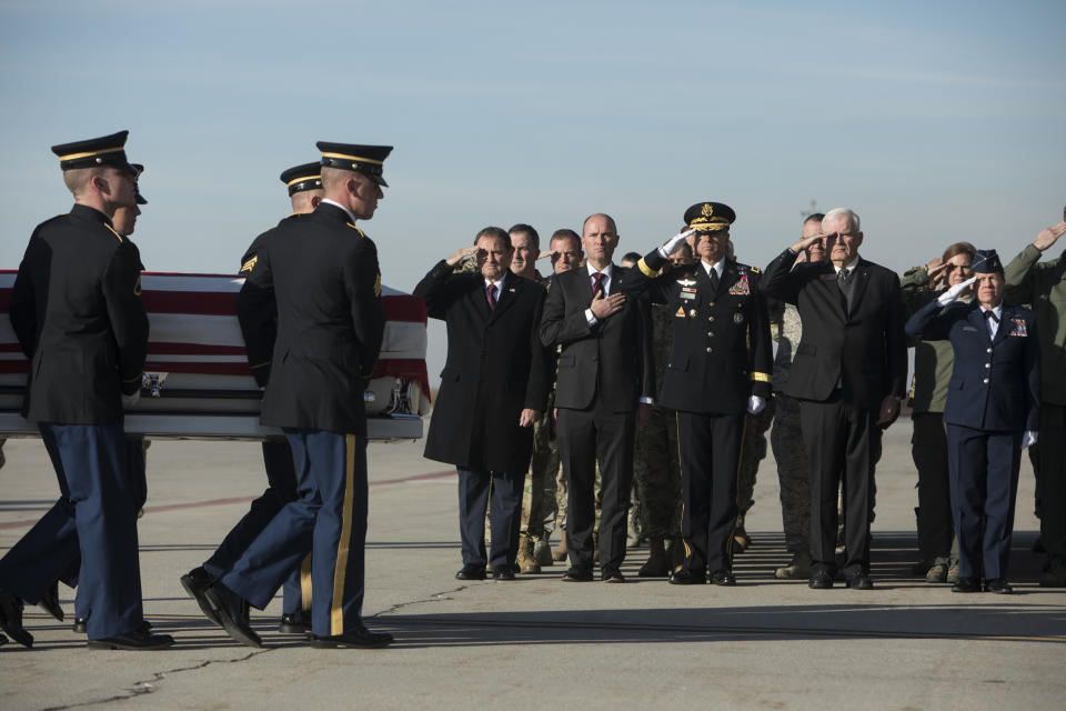 From left, Gov. Gary Herbert, Lt. Gov. Spencer J. Cox, Maj. Gen. Jefferson S. Burton, Civilian Aid to the Secretary of the Army John Edwards, and Brig. Gen. Christine Burckle salute as members of the Utah National Guard Honor Guard carry a casket containing the remains of Maj. Brent R. Taylor at at the National Guard base Wednesday, Nov. 14, 2018. in Salt Lake City. The remains of a Utah mayor killed while serving in the National Guard in Afghanistan were returned to his home state on Wednesday, Nov. 14, 2018, as hundreds of soldiers saluted while his casket covered in an American flag was carried across a tarmac and into a hearse. (Matt Herp/Standard-Examiner, via, Pool)