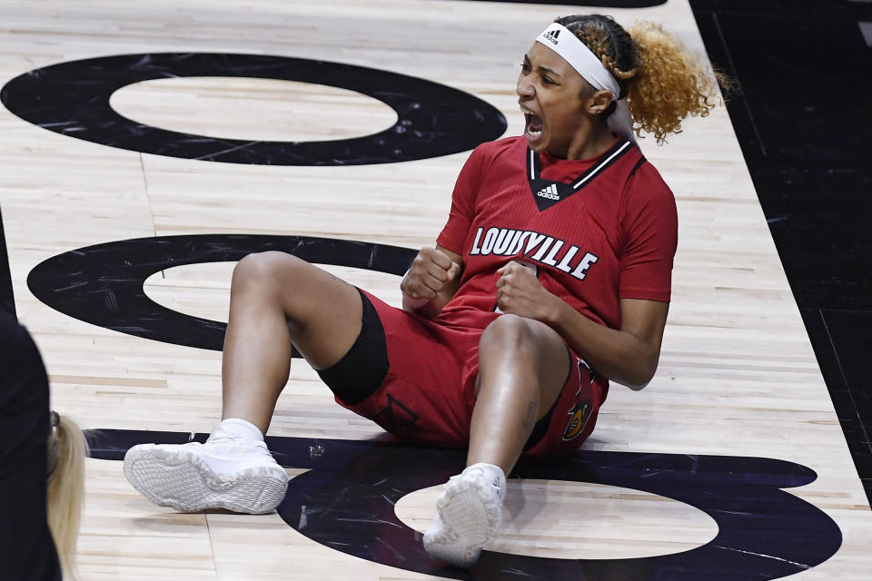 Louisville's Ahlana Smith reacts after being fouled while making a basket during the first half of the team's NCAA college basketball game against DePaul, Friday, Dec. 4, 2020, in Uncasville, Conn. (AP Photo/Jessica Hill)