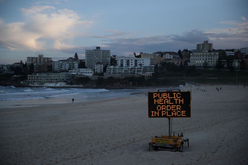 FILE PHOTO: A public health message is seen at Bondi Beach in Sydney