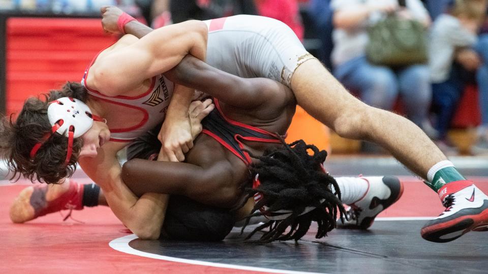 Rancocas Valley's Bryce Earlen, top, controls Cinnaminson's Nasir Page during the 132 lb. bout of  the 6th Annual Wrestling for Heroes Match held at Cinnaminson High School on Wednesday, January 25, 2023.  Earlen defeated Page, 10-1.  