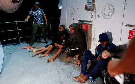 Migrants are seen on a boat after they were rescued by Tunisian coast guard off the coast of Bizerte, Tunisia October 12, 2017. Picture taken October 12, 2017. REUTERS/Zoubeir Souissi