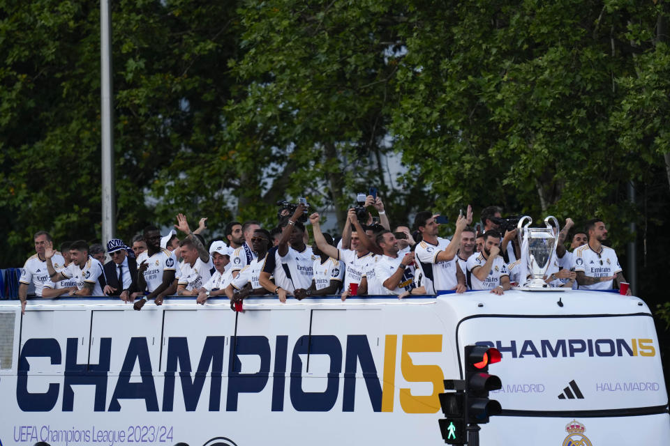 Real Madrid players celebrate during the Champions League trophy parade at the Cibeles square in Madrid, Spain, Sunday, June 2, 2024. Real Madrid won against Borussia Dortmund 2-0. (AP Photo/Bernat Armangue)