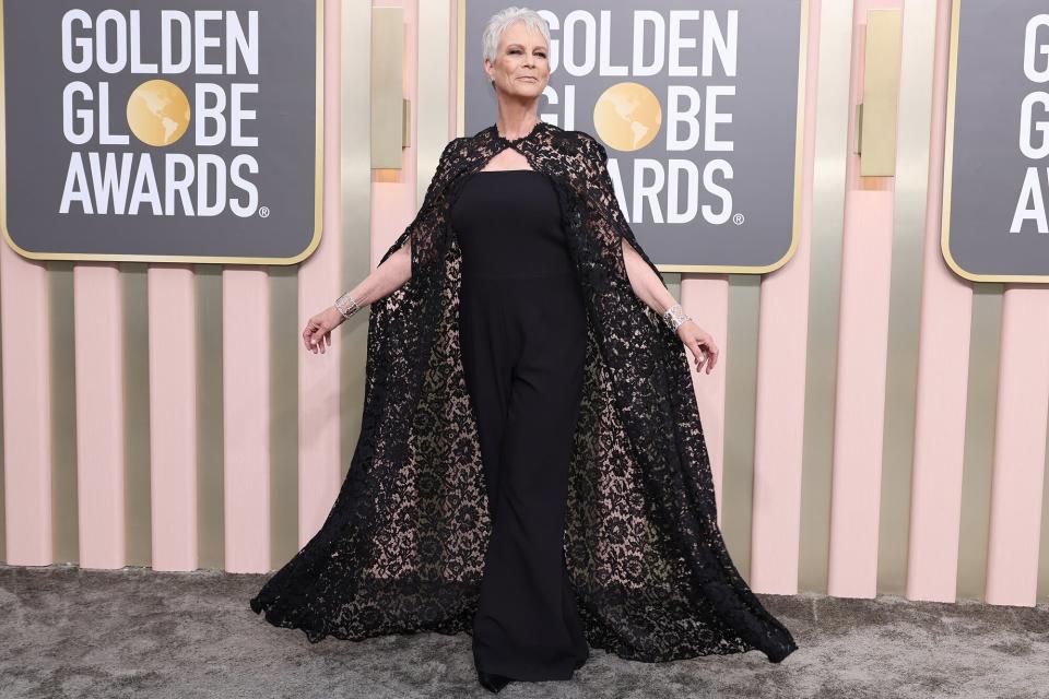Jamie Lee Curtis Walks the 2023 Golden Globes Red Carpet in a FloorLength Lace Cape
