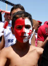 <p>A Tunisian fan with face paint is pictured before the match. </p>