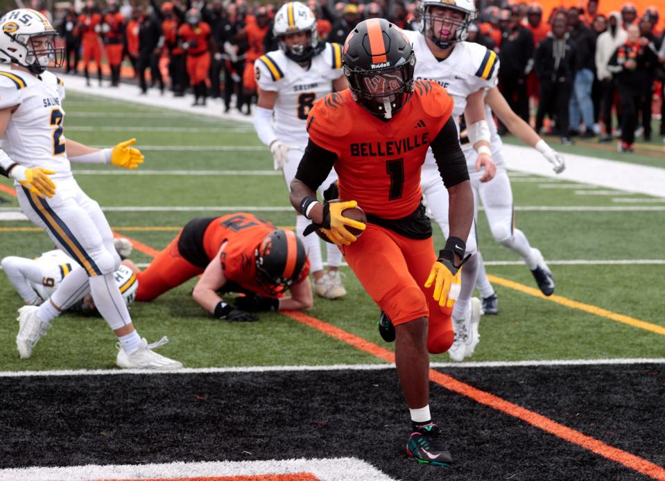 Belleville's Jeremiah Beasley gets past the Saline defense to score a touchdown during first -half action in the MHSAA Division 1 playoff game between Saline and Belleville at Belleville High School on Saturday, Nov. 4, 2023.