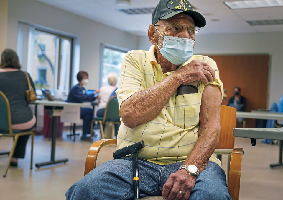 Richard Laslow, 86, of Plum, Pa., prepares to receive a COVID-19 booster shot at Allegheny General Hospital on Pittsburgh's North Side on Thursday, Sept. 23, 2021. The U.S. vaccination drive against COVID-19 stood on the verge of a major new phase as government advisers Thursday recommended booster doses of Pfizer's vaccine for millions of older or otherwise vulnerable Americans — despite doubts the extra shots will do much to slow the pandemic. (Steve Mellon/Pittsburgh Post-Gazette via AP)