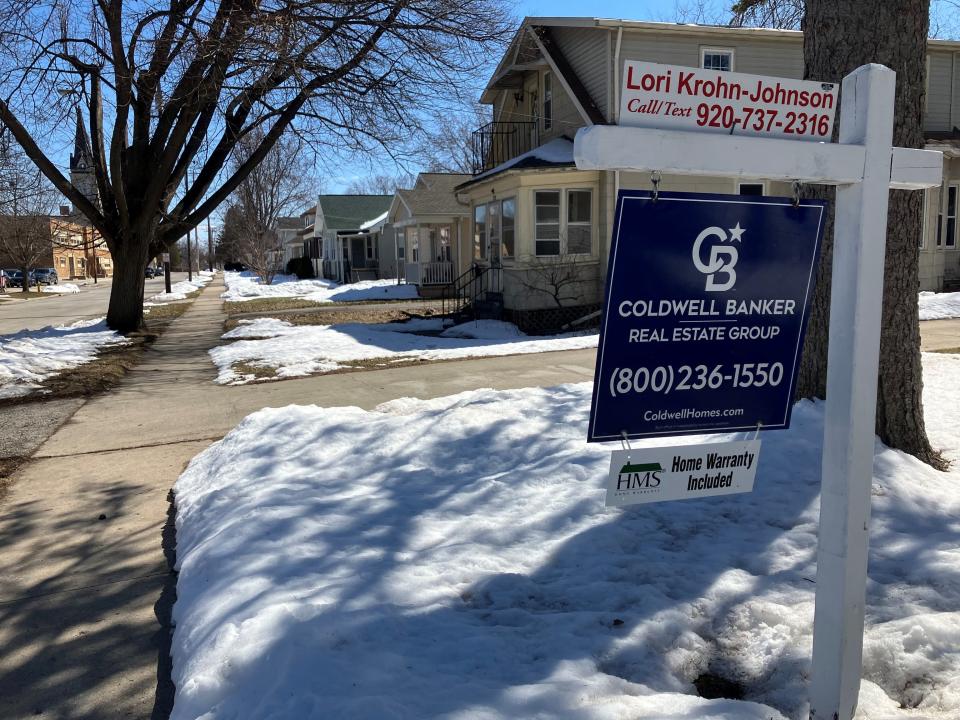 A for sale sign in a yard on Green Bay's east side in March 2023.