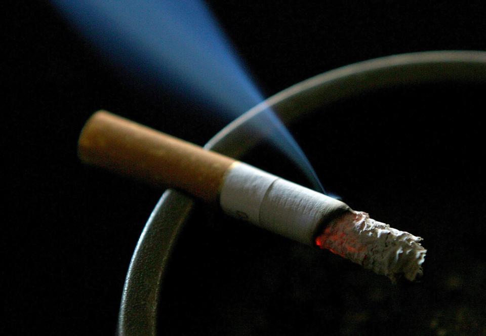 A lit cigarette smouldering on an ashtray (PA Wire)