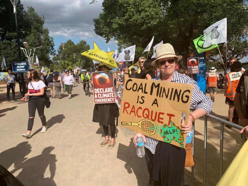 Retired teacher Libby Dougas protests against Australia’s lack of action against climate change outside the Australian Open in Melbourne