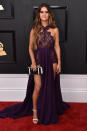 <p>In a eggplant-hued Michael Costello gown that featured a dangerously-high slit. </p>