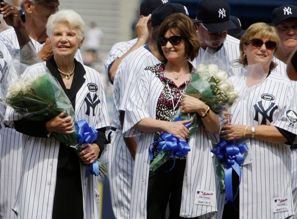 Mary Sheppard, left, the widow of New York Yankees' public address announcer Bob Sheppard, stands on the field with Kay Murcer, center, the widow of Yankee Bobby Murcer, and Diana Munson, the widow of Yankee Thurman Munson during Old-Timers' Day ceremonies at Yankee Stadium on Saturday, July 17, 2010.