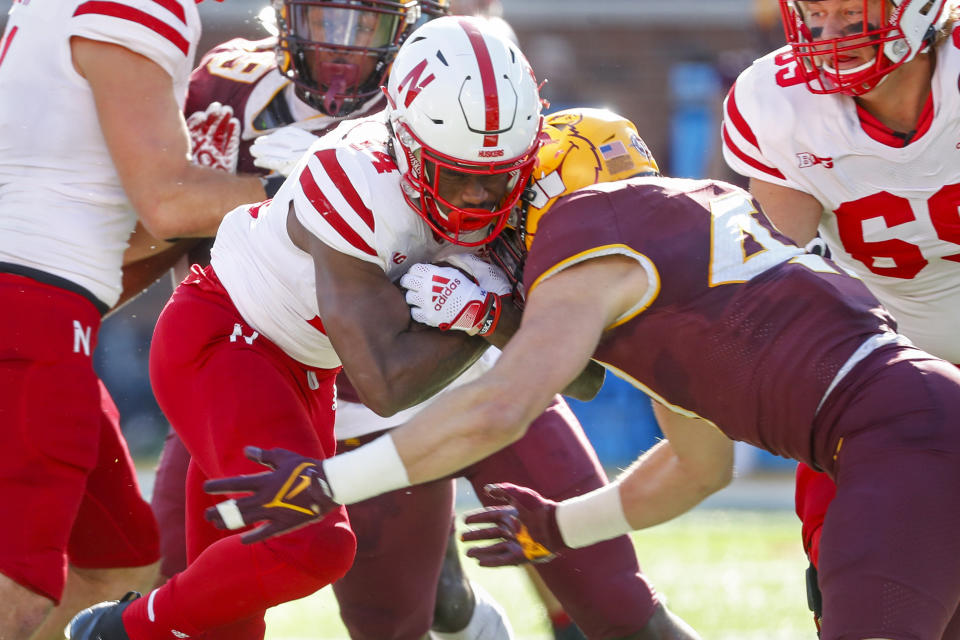 Minnesota linebacker Jack Gibbens (47) stops Nebraska running back Rahmir Johnson (14) on a run in the first quarter of an NCAA college football game Saturday, Oct. 16, 2021, in Minneapolis. Minnesota won 30-23. (AP Photo/Bruce Kluckhohn)