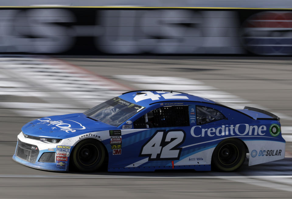 Kyle Larson crosses the start/finish line during a NASCAR Cup series auto race Sunday, March 4, 2018, in Las Vegas. (AP Photo/Isaac Brekken)