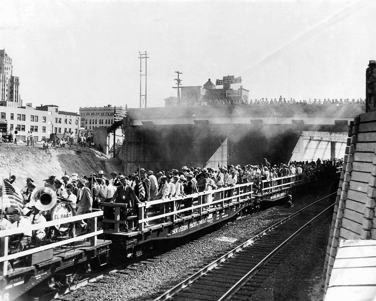 08/22/1950 FREE RIDE - Boosters of Bataan Memorial Trainway, riding a special train of six flatcars and caboose, inspect the finished project in a sightseeing tour. On the first car are members of the American Federation of Musicians band.