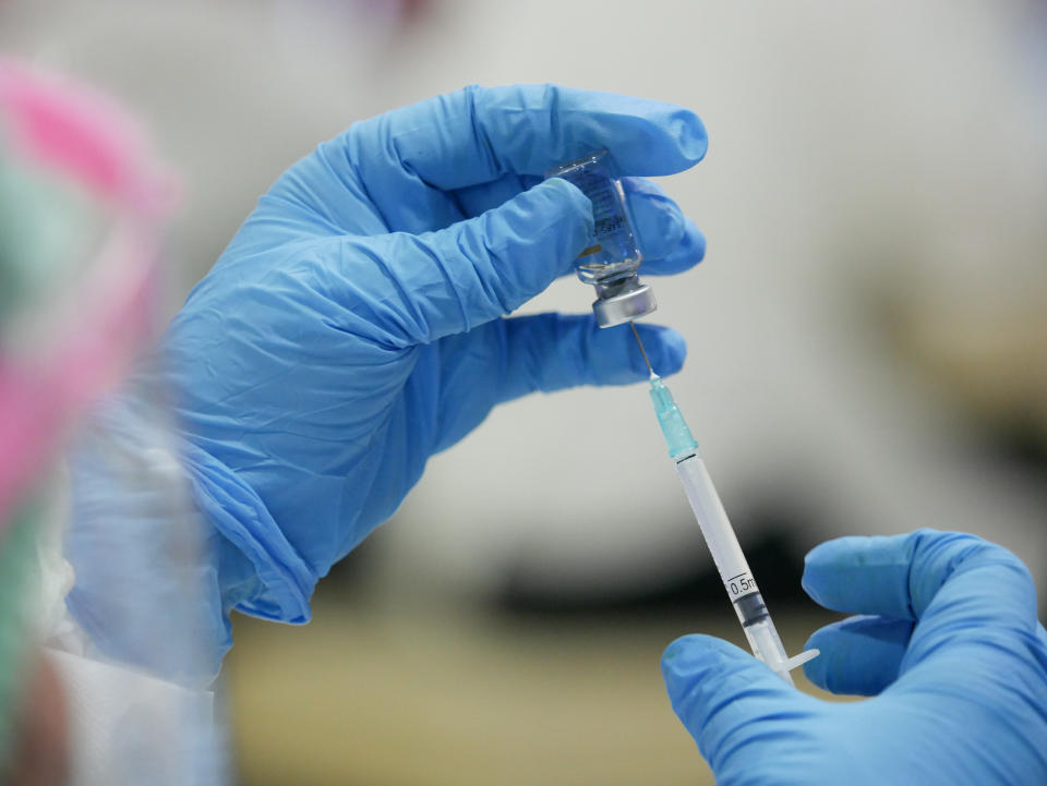 A medical officer prepares a SinoVac COVID-19 vaccine for Indonesian traders at Tanah Abang market in Jakarta, Indonesia on February 17. Source: Getty