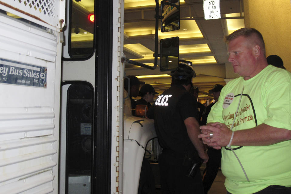 FILE - Bob McDevitt, president of Local 54 of the Unite-HERE union, boards a sheriff's office bus after being arrested for blocking traffic outside the Tropicana Casino and Resort in Atlantic City N.J. on June 15, 2012 during an economic protest. McDevitt is stepping down as president of the main Atlantic City casino workers union, Local 54 of Unite Here, after 26 years as one of the most powerful people in Atlantic City. On May 1, 2023, he'll become head of the union's national pension plan. (AP Photo/Wayne Parry, File)